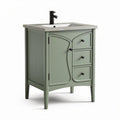 Green bathroom vanity with stone top and three drawers 30 x 18 x 34 inches